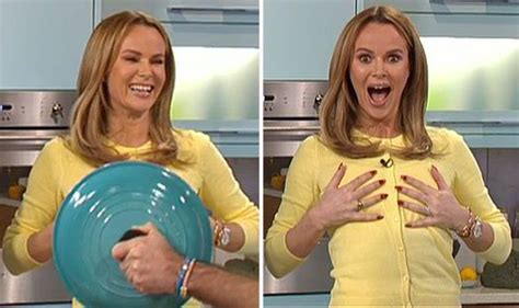 Amanda Holden Cheekily Pretends To Flash Her Chest Towards The Camera On This Morning