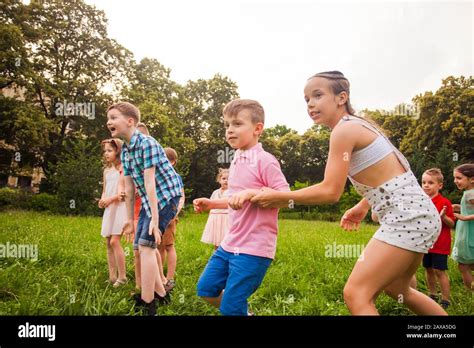 Group Of Happy Kids Playing Games In Summer Camp Stock Photo Alamy
