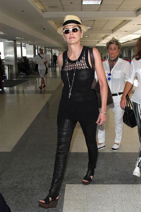 Barely There Sharon Stone Goes Braless At LAX And Looks Hot