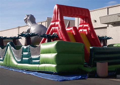 Carrera de obstáculos inflable del dinosaurio jurásico asombroso del