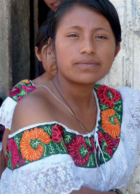 A Young Woman From Simbaca Chiapas Mexico Wears A Blouse With