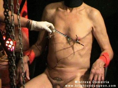 Mistress Dometria BDSM Clips Nipples Pierced With Meat Hooks