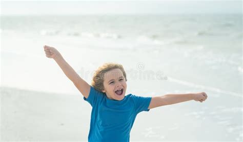 Happy Boy Enjoys Run On Beach Amazed Child Face Expressive Emotional
