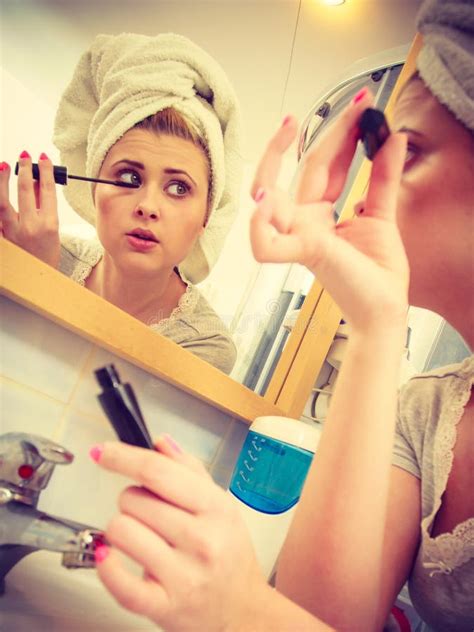 Woman In Bathroom Applying Mascara On Eyelashes Stock Photo Image Of