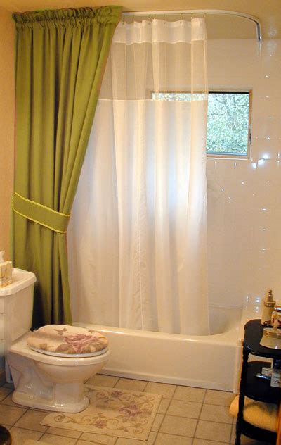 The water from the shower sluices along with the curtains and falls into the enclosure while the rest of the bathroom remains. Shower Rods: Custom Ceiling Shower Curtain Rods