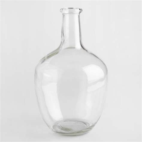 A Clear Glass Vase Sitting On Top Of A White Table