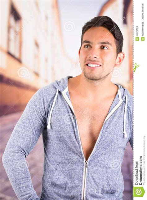 Handsome Latin Man Wearing A Hoodie Posing Stock Photo Image 57079124