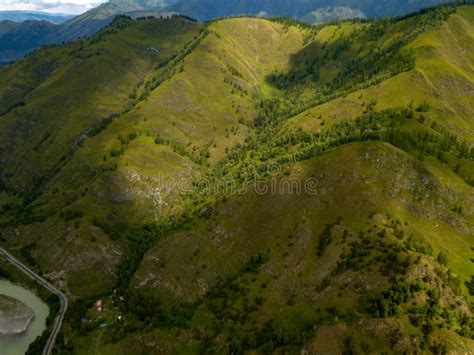 Aerial View Of The Mountains With Green Grass And Trees With Lot Stock