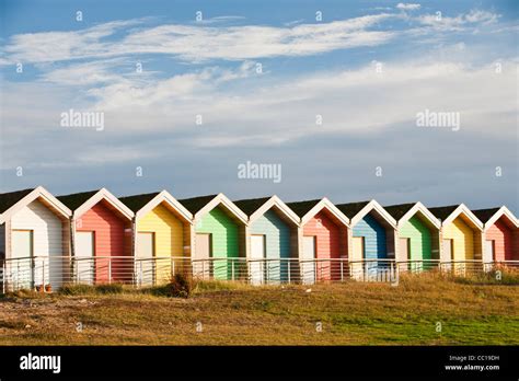 Colourful Traditional British Seaside Beach Huts On The Beach In Blyth