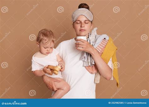 Indoor Shot of Young Tired Mom and Little Child after Sleepless Night