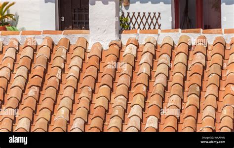 Traditional Old Spanish Ceramic Roof Tiles On A Building