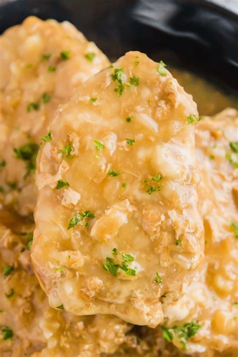 All in an easy slow cooker recipe. Say goodbye to dry and tough pork chops: these Smothered ...