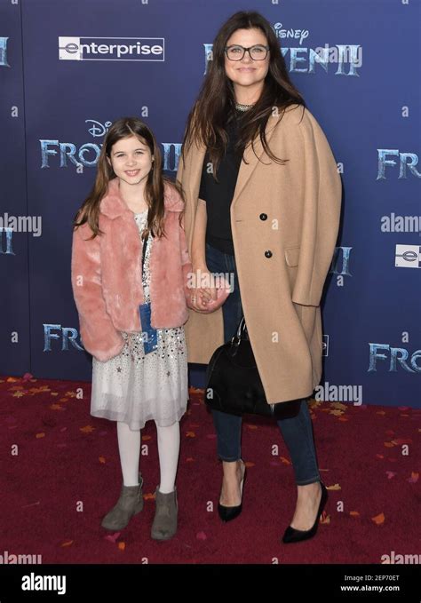 L R Harper Renn Smith And Tiffani Thiessen At Disneys Frozen 2 World Premiere Held At The