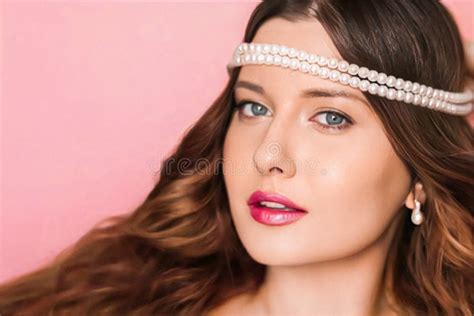 Beauty Face Portrait Beautiful Woman With Pearl Jewellery And Glossy Lipstick Make Up On Pink