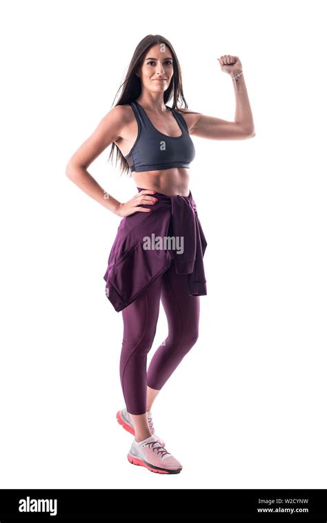 Motivated Young Fit Healthy Attractive Woman Flexing And Showing Bicep