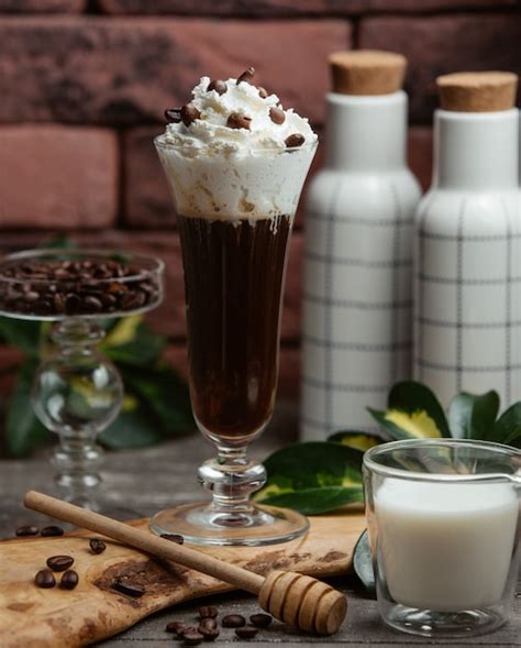 Dark Cold Coffee With White Whipped Cream Free Photo