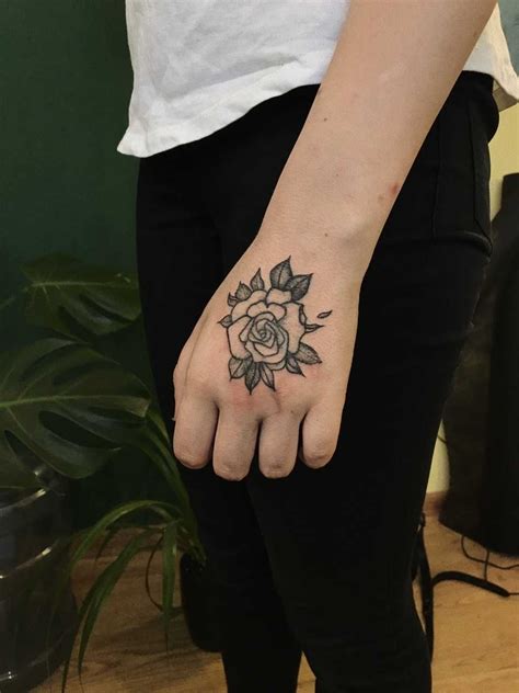 Simple Rose Tattoo On The Left Hand