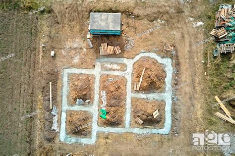 Top Down Aerial View Of Building Works Of New House Concrete Foundation