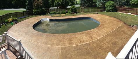 Stamped Concrete Pool Deck With Custom Chiseled Stone Cantilevered Concrete Coping By Sierra