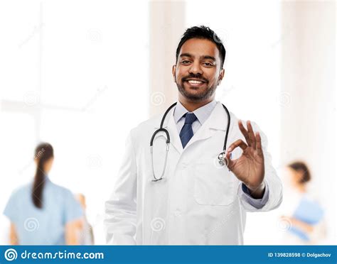 Smiling Indian Male Doctor Showing Ok Gesture Stock Photo - Image of ...