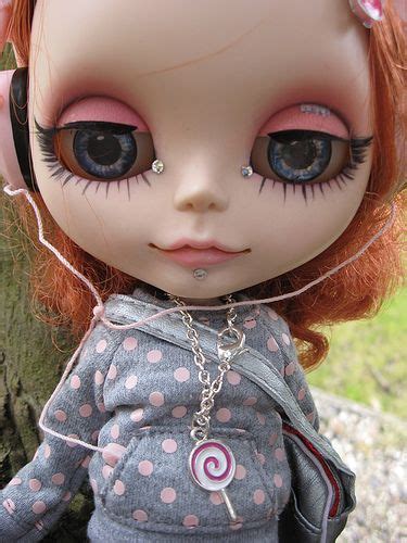A Close Up Of A Doll With Big Eyes