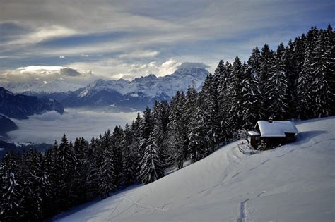 Maybe you would like to learn more about one of these? Cabin on the snowy mountain side - Photorator
