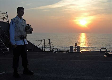 A Sailor Aboard Uss Ross Ddg 71 Takes A Breather Nara And Dvids