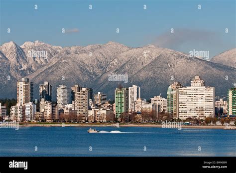 Vancouver Skyline The Snow Capped North Shore Mountains Form A