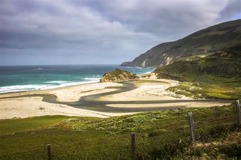 River Through Sandy Beach With Sea On California Highway 1 Stock Image