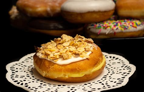 Raised Pastry Cream And Almond Puff Donuts Prantls Bakery