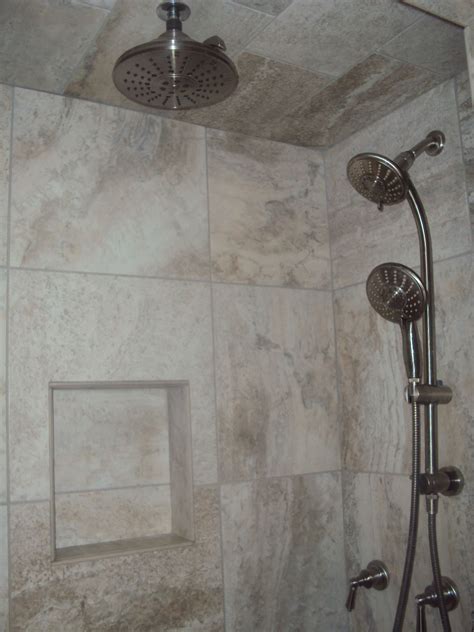 This master bathroom makeover has been needed for a looong time. master bathroom, tile, rain showerhead, dual showerheads ...