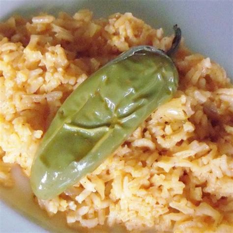 It's an easy and delicious side dish that goes great with tacos, burritos, and enchiladas! Maria's Mexican Rice Photos - Allrecipes.com