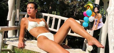 Dua Lipa Flaunts Her Svelte Figure In A White Bikini As She Rings In