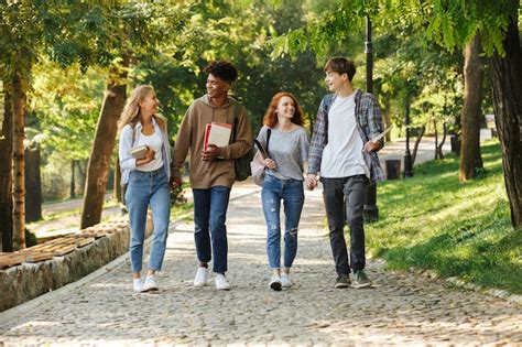 Premium Photo Group Of Happy Student Walking At The Campus Outdoors