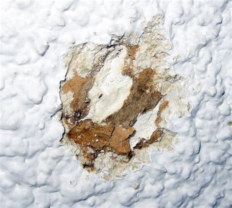Asbestos ceiling stipple (popcorn ceiling). Could there be asbestos in the thick brown paper / card ...