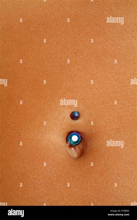 Navel Piercing In Womans Belly Button Stock Photo Alamy