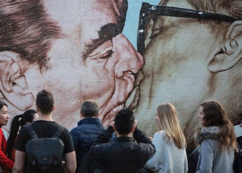 Mural Depicting Trump And Netanyahu Sharing A Kiss Pops Up On West Bank Wall