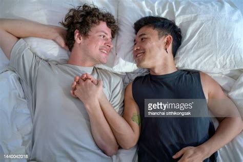 gay couple kissing in bed photos and premium high res pictures getty images