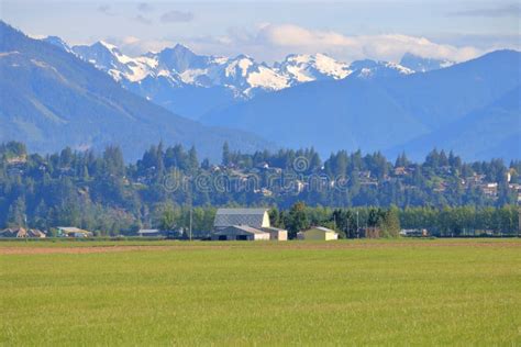 Snow Capped Mountains And Agricultural Valley Stock Image Image Of