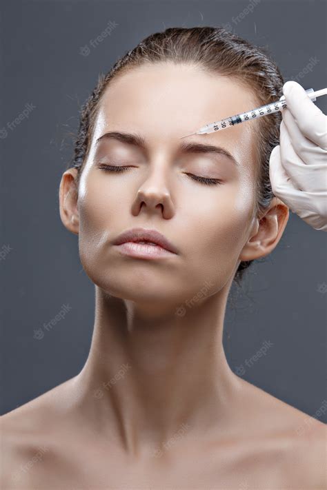 Premium Photo The Doctor Cosmetologist Makes The Rejuvenating Facial