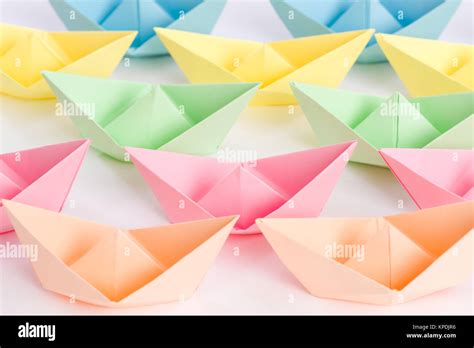 Overwhelming Fleet Of Origami Paper Ships Passing By Stock Photo Alamy