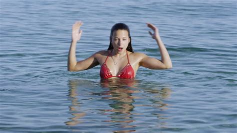 Beautiful Woman Emerging From The Water At The Beach Stock Footage Video 7591366 Shutterstock