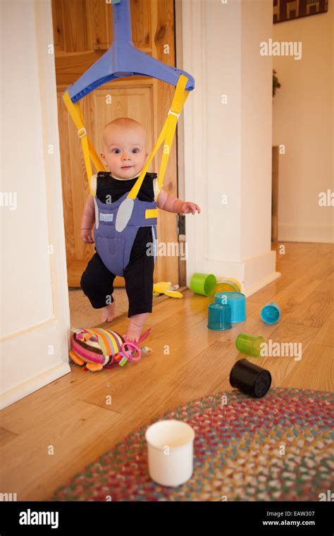 Baby In A Door Bouncer Stock Photo Alamy