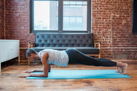 Determined Black Woman Doing Forearm Plank At Home · Free Stock Photo