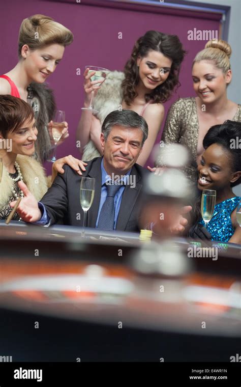 Man Surrounded By Women Accepting Of Loss Stock Photo Alamy