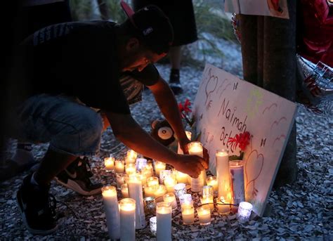 Dozens Gather To Mourn 15 Year Old Girl Outside Of The Apartment Where She Was Shot