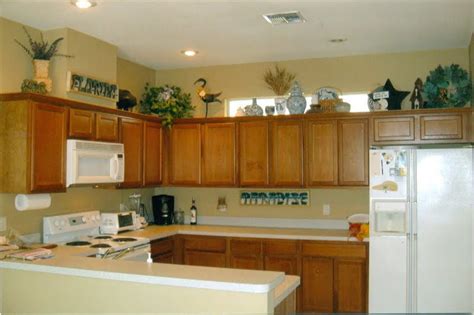 If your cabinets have glass doors, you might be wondering how best to display your dishes in them. The Tricks You Need To Know For Decorating Above Cabinets ...