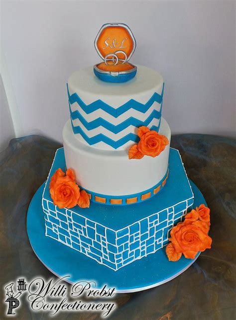 Three Tier Blue And Orange Wedding Cake Orange Wedding Cake Cake Blue