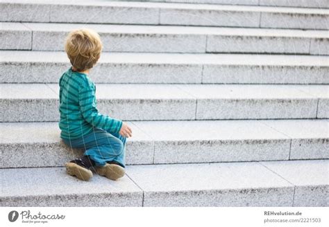 Child Sitting On A Staircase A Royalty Free Stock Photo From Photocase
