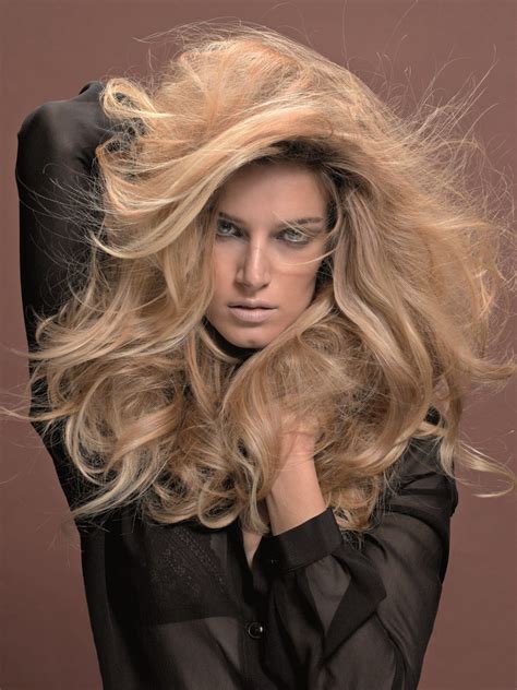 Mushroom blonde is probably one of the biggest hair color trends swirling about this summer, and for good reason. Big and voluminous blonde hair with long layers